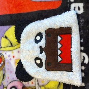 Domo disguised as a panda beanie